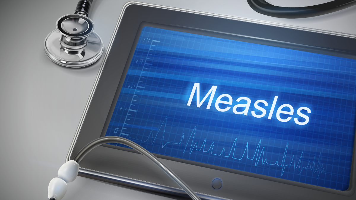 measles word displayed on tablet with stethoscope